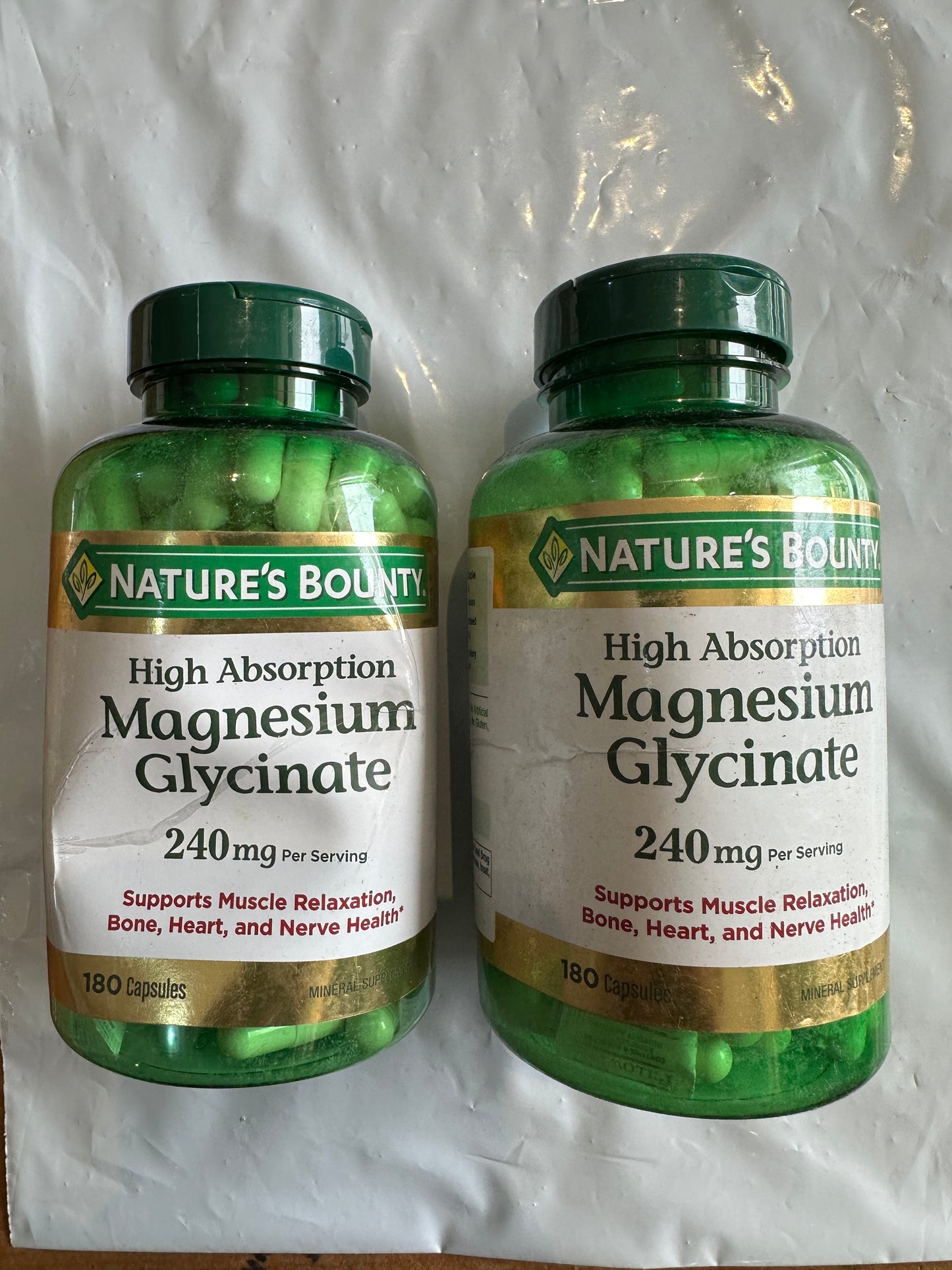 Nature's Bounty High Absorption Magnesium Glycinate 240mg | Supports Muscle Relaxation | Supports Bone, Heart, and Nerve Health | 180 Capsules; Exp 09/2027 -SQUEEZED DURING SHIPPING TO NIGERIA-See last picture